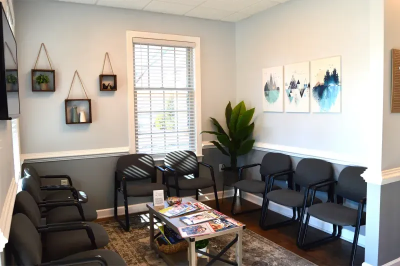 black chairs and mini table, Apple Blossom Dentistry reception area