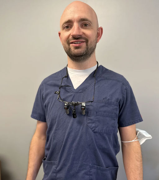 dentist in blue scrub suit